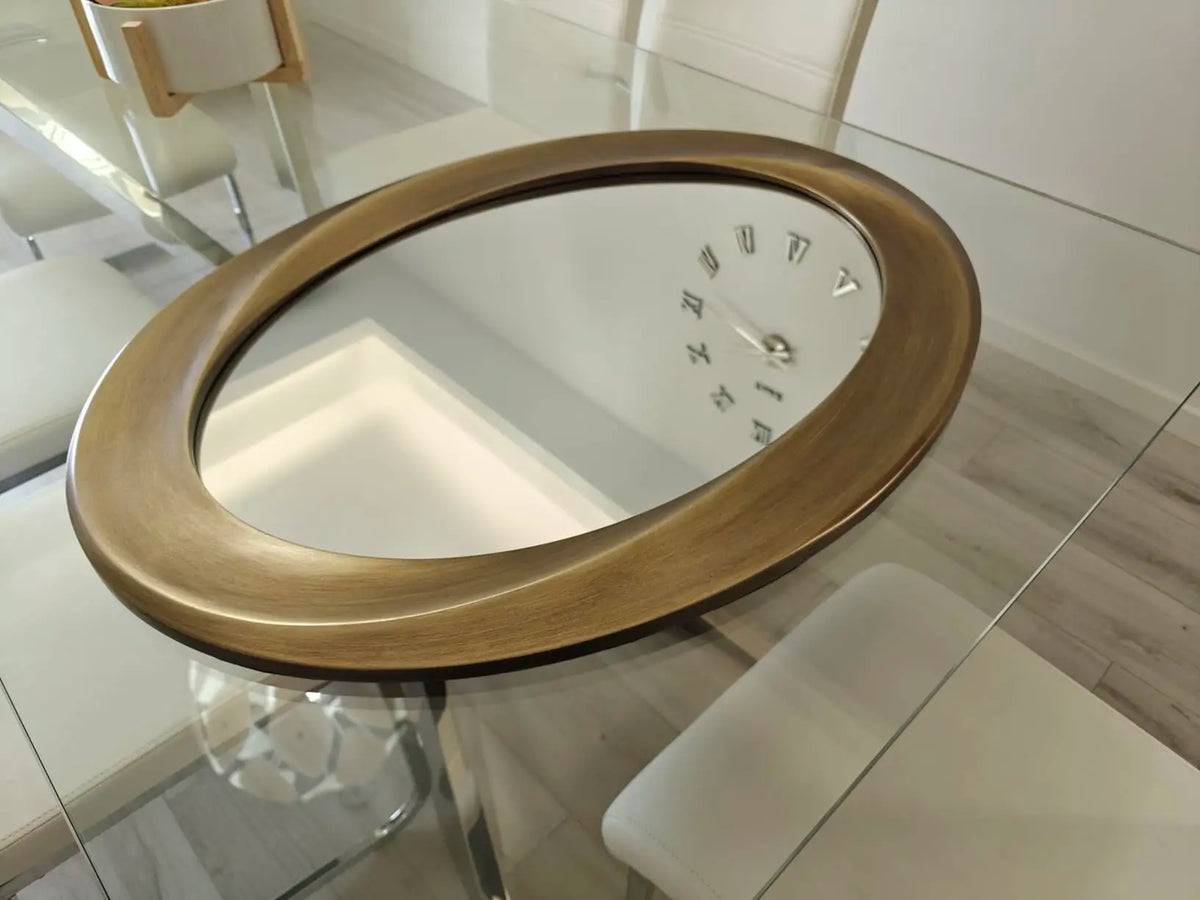 Elegant Oval Wall Mirror Featuring A Beveled Ornamental Frame